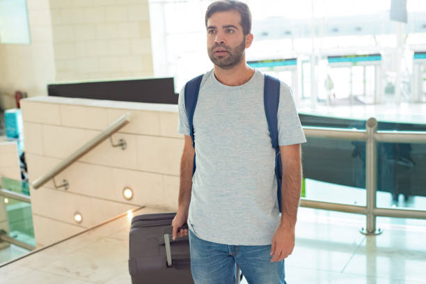 istock Medium shot of focused young man with luggage 1189068851
