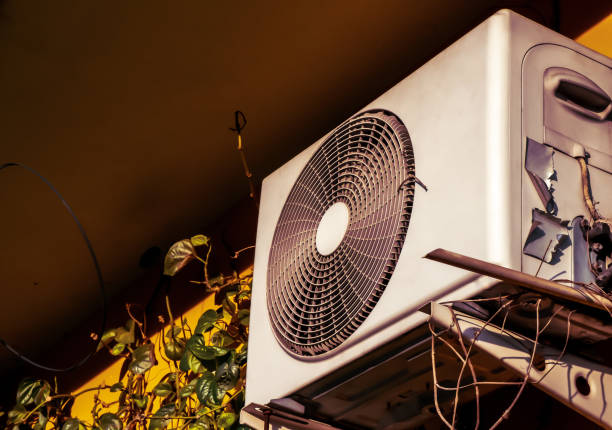 The retro of an evaporator coil and condenser coils of air conditioner in the classic house stock photo