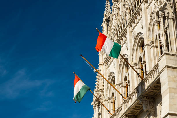 Hungarian flags on the Hungarian Parliament Building or Parliament of Budapest, a landmark and popular tourist destination in Budapest, Hungary stock photo