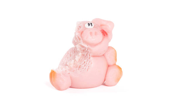 istock Marzipan pig, ready to be eaten, one bite already 1189070584