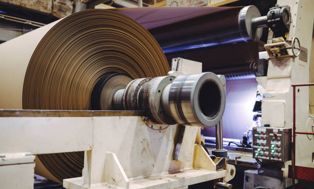 istock paper carton making factory machine huge cellulose 1189072272