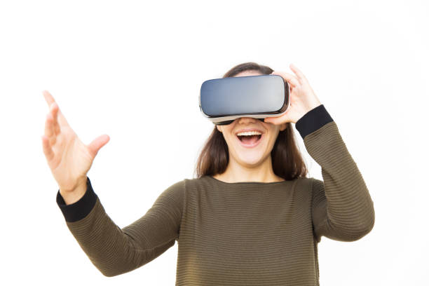 istock Joyful excited student in VR headset laughing and touching air 1189081172