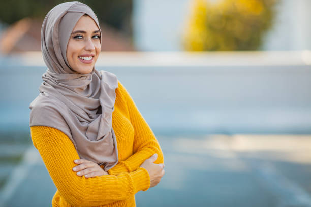 Muslim women with smiling face Muslim woman wearing hijab with a happy face standing and smiling with a confident smile showing teeth. Muslim women with smiling face. Beautiful middle eastern woman wearing abaya turkey middle east stock pictures, royalty-free photos & images