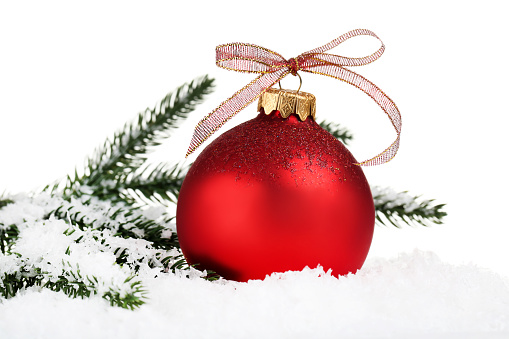 Christmas bauble with fir tree branches on white background