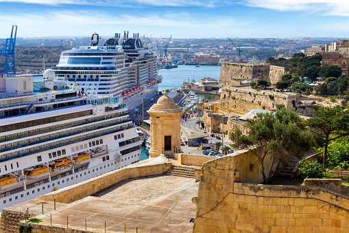 Valletta, Malta - September 16, 2019: Vew from the terrace Barrakka garden in the harbor and moored at quay two giant cruise ships, Valletta, Malta