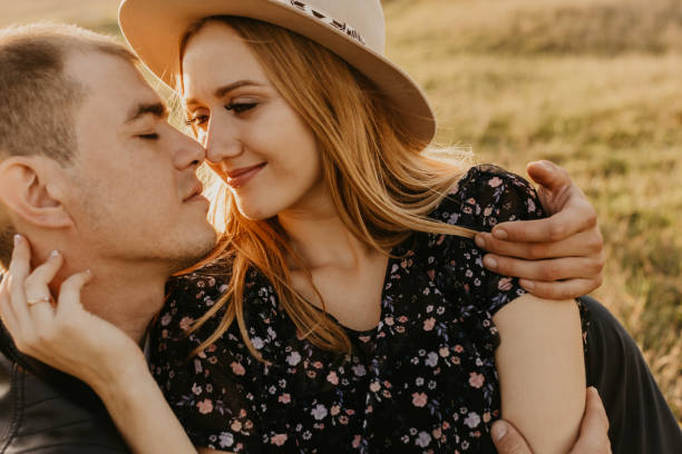 istock Happy young couple enjoying outdoors during sunset - Image 1189083577