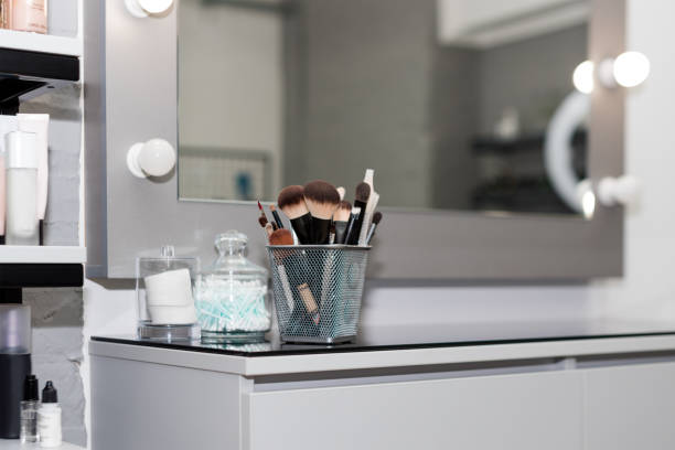 istock Professional makeup brushes set closeup near salon mirror. Brush any size for professional make-up artist on blur background 1189083703