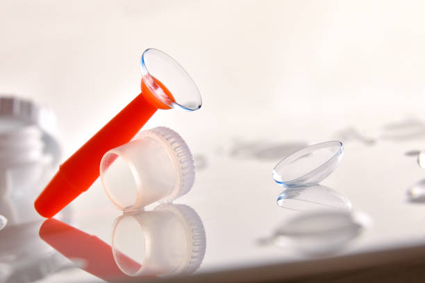 istock Contact lens in an applicator on a glass table 1189086293