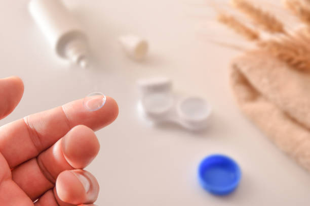 istock Hand with lens on the finger with maintenance products background 1189086298