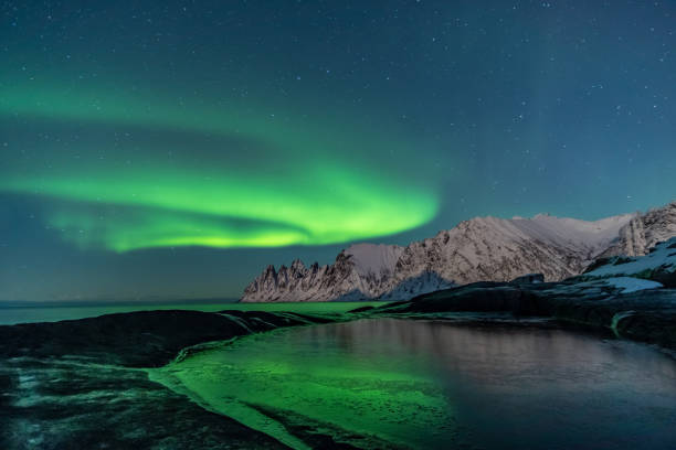 istock Northern lights, Aurora Borealis, Devil Teeth mountains in the background, Tungeneset, Senja, Norway 1189086528