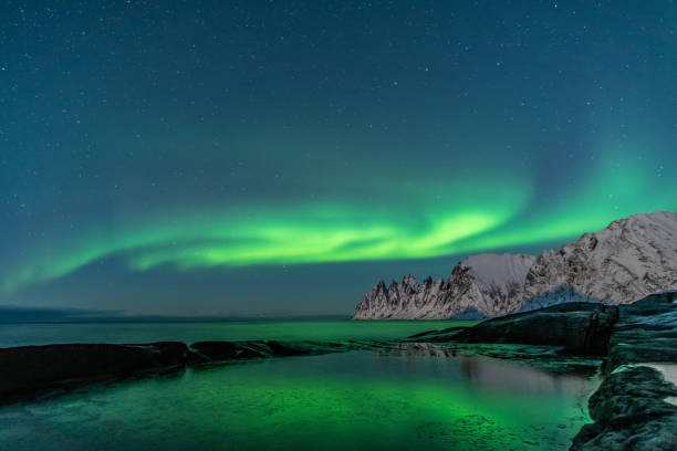 istock Northern lights, Aurora Borealis, Devil Teeth mountains in the background, Tungeneset, Senja, Norway 1189086560