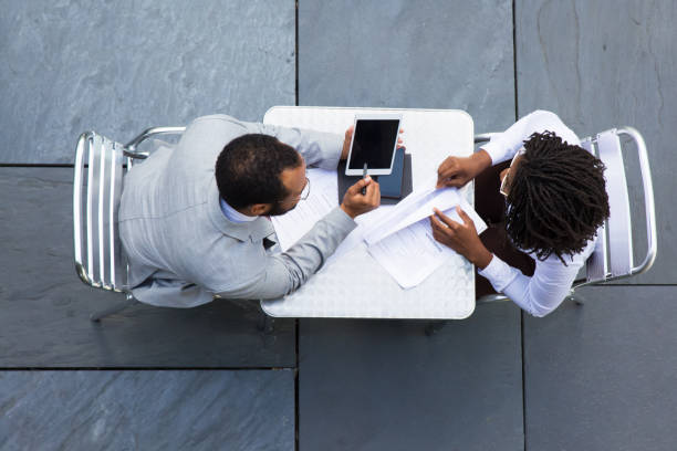 istock Top view of African American man pointing on tablet 1189089683