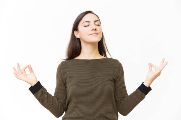 istock Peaceful tranquil female student making zen gesture 1189090025