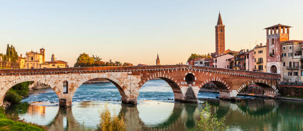 The old Ponte Pietra is a five-arched bridge crossing the river Adige, one of the most notable evidences of the Roman period in Verona, northern Italy. People.