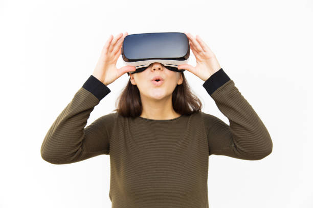 istock Surprised excited gamer in VR headset 1189090724