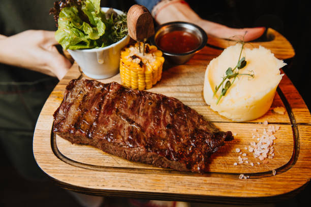 istock Juicy steak with vegetables on a wooden Board 1189090776