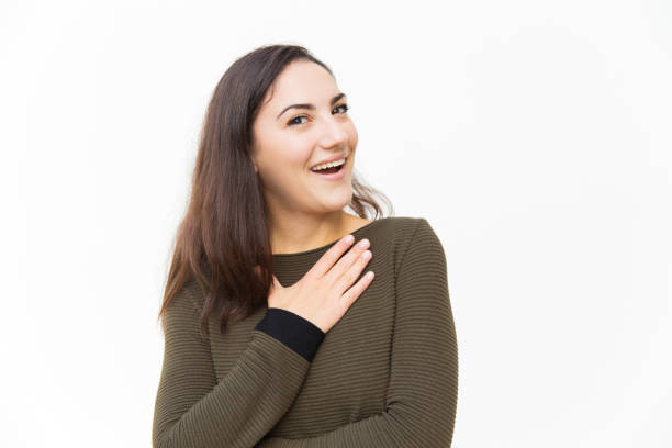 istock Impressed excited beautiful woman keeping hand on chest 1189091143