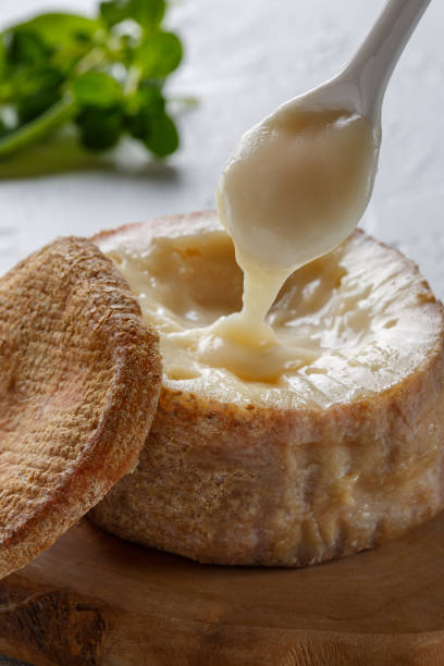 istock Spanish traditional sheep cheese with very creamy texture, almost liquid on white background. 1189091327