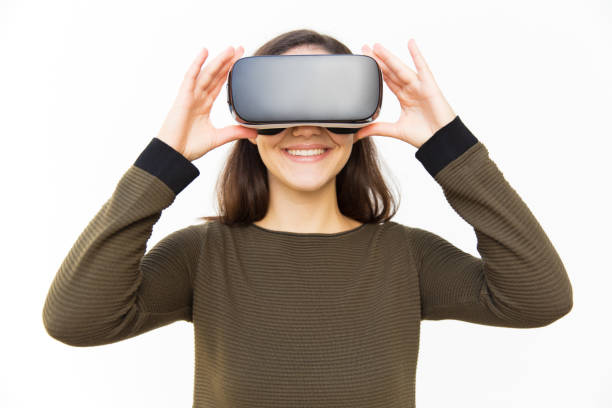 istock Cheerful happy gamer in VR headset touching device 1189092777
