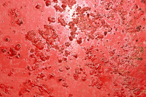 rugged and weathered red metal texture background.