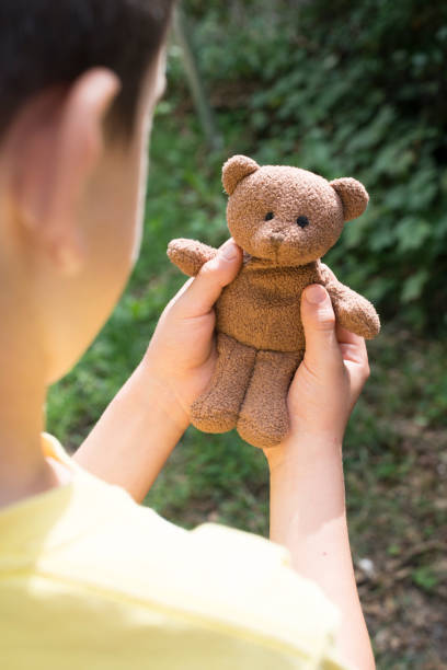 istock Child hold teddy in the hands 1189095242