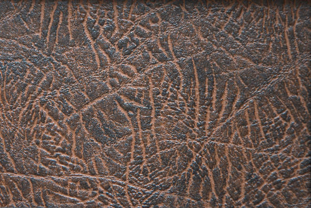 istock The texture of genuine leather, roughly processed, dark brown with light veins. 1189095914