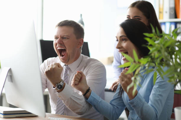 istock Cute colleagues holding fists 1189095936