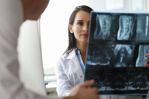 istock Young doctor with skiagram 1189095946