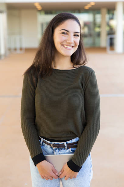 istock Happy joyful female student with tablet posing indoors 1189096574