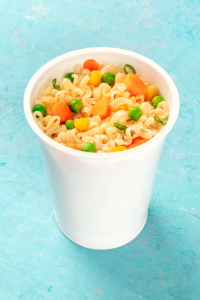 istock Ramen cup, instant soba noodles in a plastic cup with vegetables close-up 1189096718