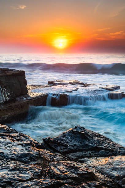 istock Rocky Smoke Haze Sunrise Seascape 1189098814