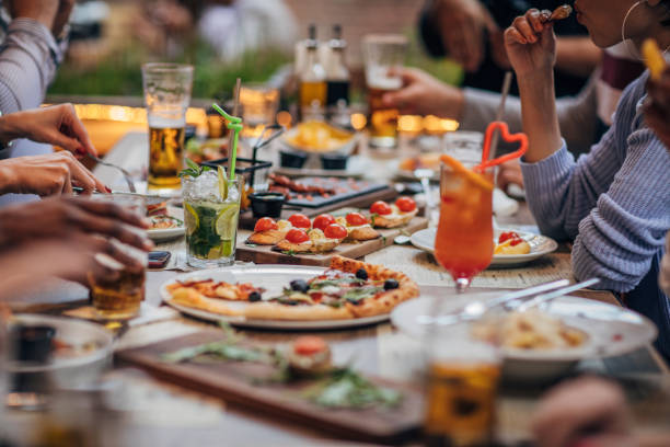 istock Group of friends on lunch outdoors in restaurant 1189100161