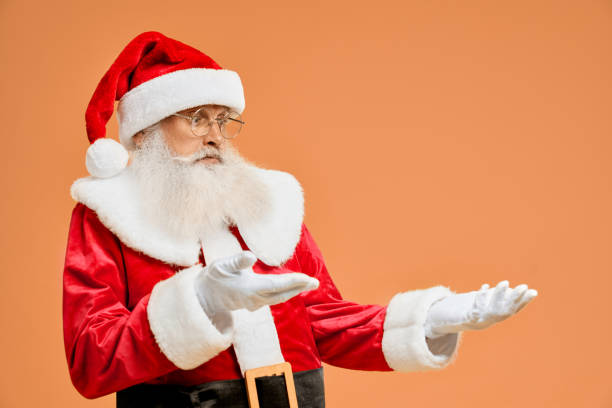 istock Christmas character showing empty copy space on open palm 1189101822