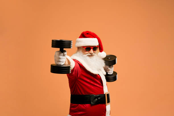 istock Elder Saint Nicholas in sunglasses exercising with dumbbells 1189101942
