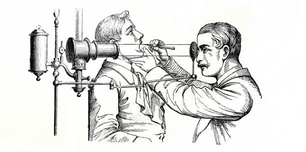 Doctor checks the patient's throat by a special device