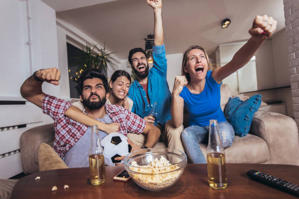 istock Friends watching sport on tv 1189103687