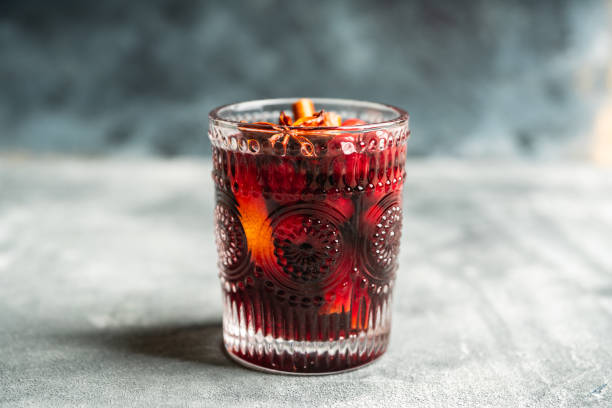 Mulled red wine on the rustic background Mulled red wine on the rustic background. Selective focus. Shallow depth of field. mulled wine photos stock pictures, royalty-free photos & images