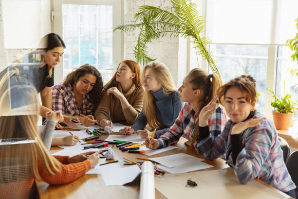 istock Young people discussing about women rights and equality at the office 1189106536