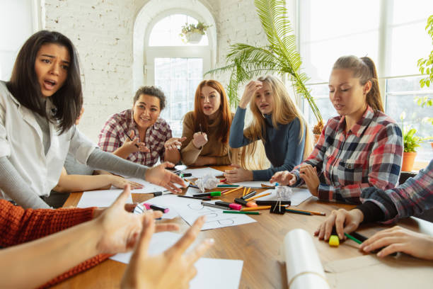 istock Young people discussing about women rights and equality at the office 1189107157