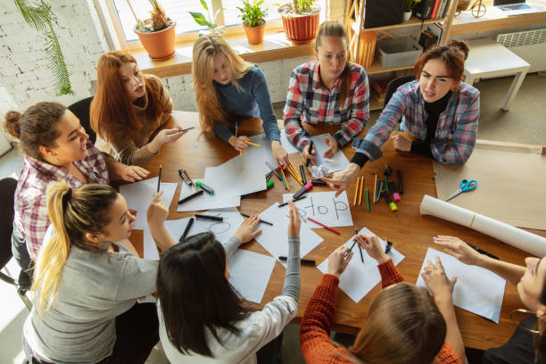 istock Young people discussing about women rights and equality at the office 1189107163