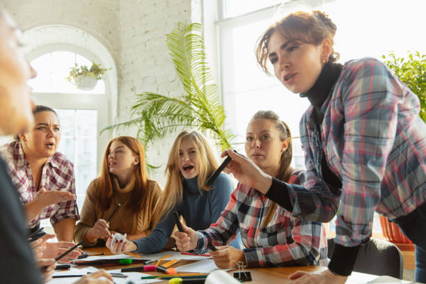 istock Young people discussing about women rights and equality at the office 1189107178