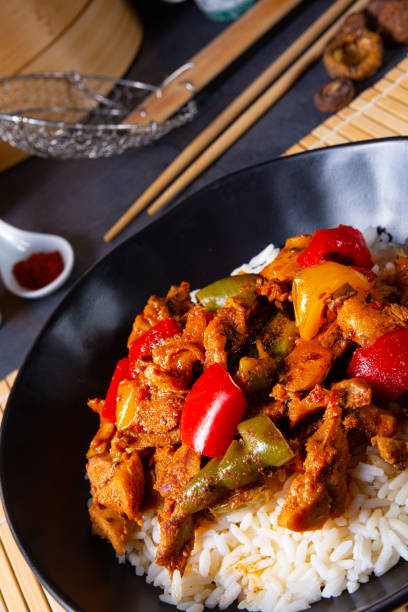 istock Hot roasted chicken with rice and vegetables 1189107417