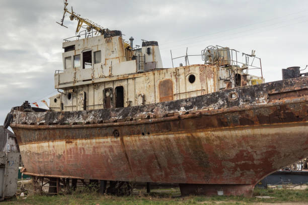 istock Rusty decommissioned marine ship that was left on the shore. 1189108776