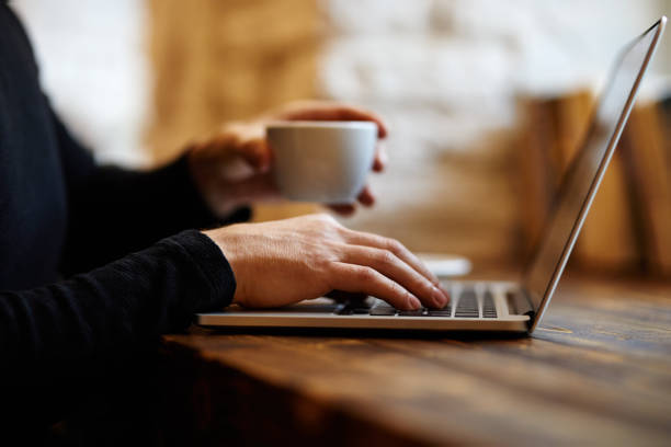 istock Man working on laptop in cafe 1189112834