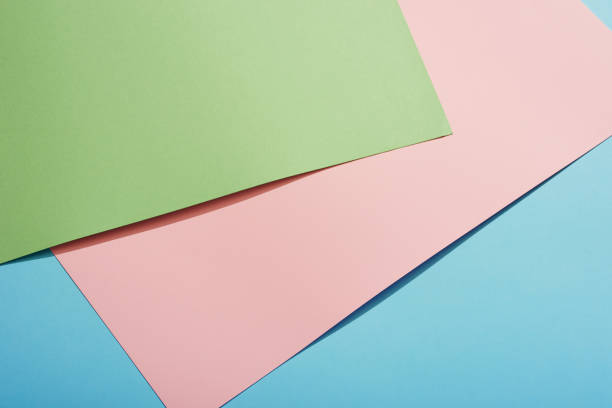 istock Color papers geometry flat composition background with green pink and blue tones 1189113084