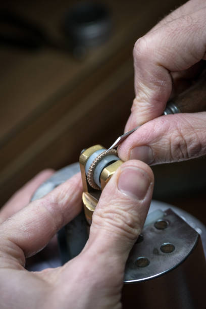 istock Professional gemstone settings jewellery craft laboratory: man working with microscope 1189114751