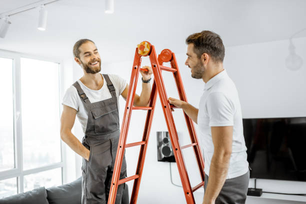 istock Two workmen talking during some repairment at home 1189116119