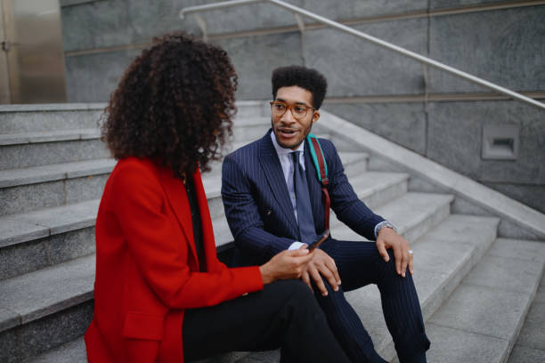 istock Smiling business couple chatting on their way to work 1189117595