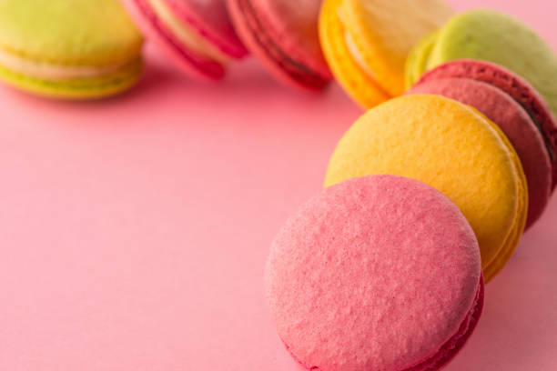 istock Sweet macarons on pink background 1189117819