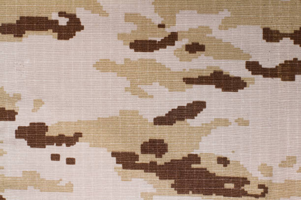 istock A texture of a pixelated camouflage fabric 1189120311